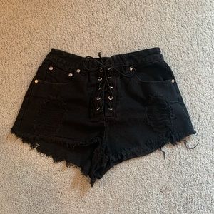 Black lace-up detailed denim shorts
